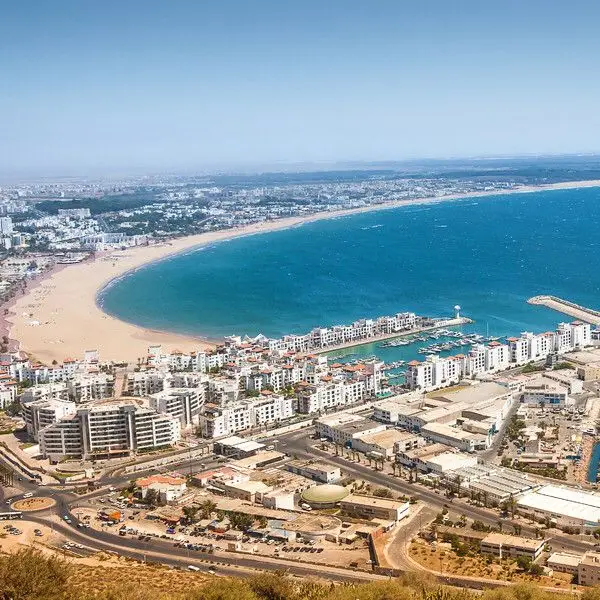 Scenic view of Agadir beach with golden sand and calm Atlantic waves under a clear blue sky”
