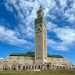 Majestic view of the Hassan II Mosque under a clear blue sky in Casablanca.