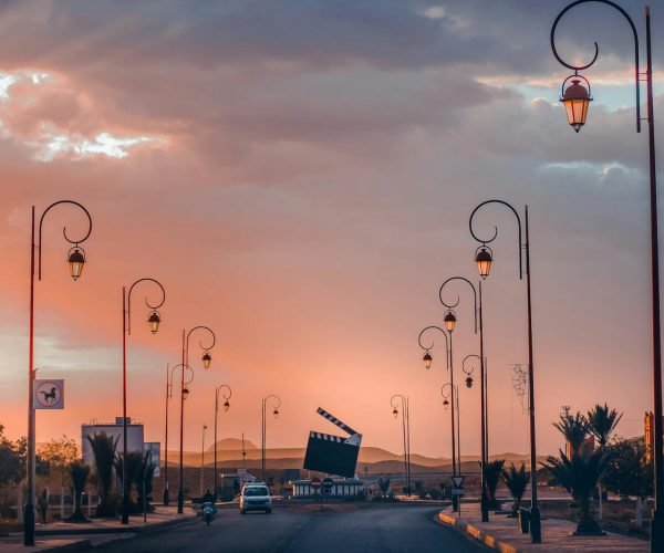 Explore the cinematic streets of Ouarzazate, Morocco, under a stunning sunset glow.