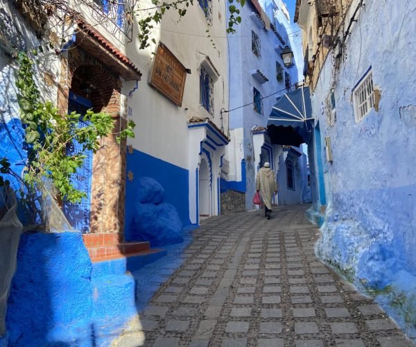 Explore the iconic blue streets of Chefchaouen, Morocco, known for vibrant architecture and cultural charm.