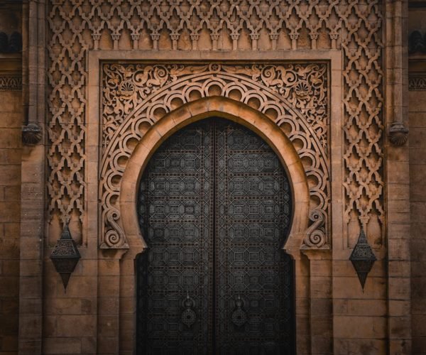 Detailed ornate Moroccan doorway showcasing Islamic architectural style in Rabat, Morocco.